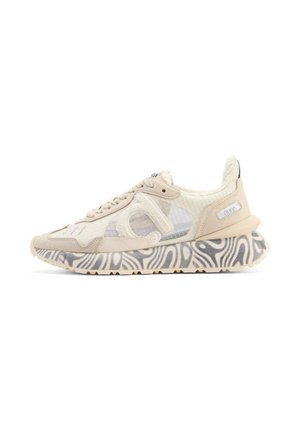 Beige sneaker with shearling details, transparent mesh panels, and black-and-white swirl patterned sole, viewed from the side.