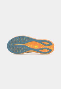 Shoe sole with an orange and blue color scheme, featuring a textured surface and perforations for traction and flexibility.