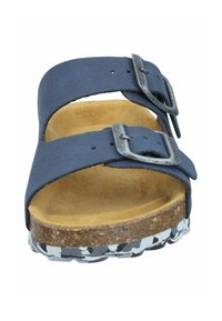 Navy blue slip-on sandal with two adjustable straps, metallic buckles, a cork base, and a textured white and black patterned sole.