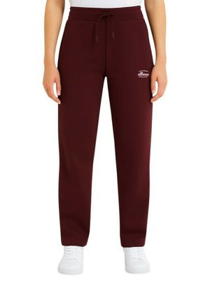 Pantalon de survêtement bordeaux avec taille élastique, fermeture à cordon, poches latérales et un logo blanc sur la cuisse gauche.