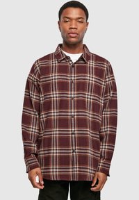Flanellhemd in Burgunderrot, Schwarz und Beige mit Karo-Muster, langen Ärmeln, Knopfleiste vorne und lockerer Passform. Verfügt über einen klassischen Kragen.
