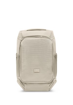 Beige rectangular backpack with front zippered pocket, padded structure, side pockets, and top handle, displaying Johnny Urban logo.