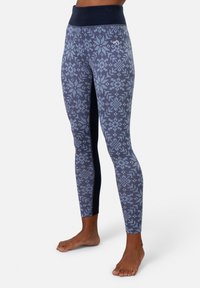 Leggings met een marineblauw en lichtblauw geometrisch patroon, met een brede zwarte tailleband en een gladde, rekbare textuur.