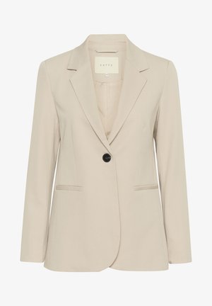 Blazer beige con un singolo bottone nero, revers a punte e due tasche frontali. Realizzato in un tessuto liscio, presenta un design avvitato.