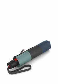 Compact umbrella in a zippered case. Case features teal, black, and navy sections. Handle has a red button and a wrist strap for convenience.