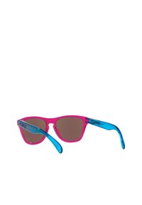 Sunglasses with a pink frame and blue arms. Brown tinted lenses, angular design, and logo detail on the arm. Lightweight plastic material.
