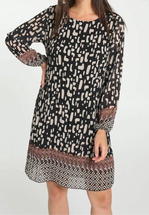 Vestido negro con patrones abstractos beige, mangas largas con detalles estampados y un diseño geométrico en el dobladillo en color óxido y crema.