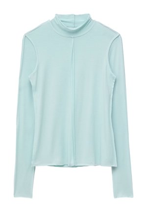 Haut à col roulé bleu clair à manches longues avec une couture verticale au centre devant.