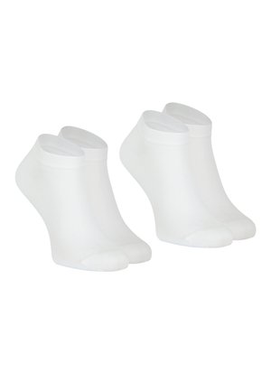 Chaussettes blanches до cheville en tissu respirant. Elles sont dotées de bords côtelés et de zones renforcées au niveau des orteils et du talon. Texture lisse, design minimal.