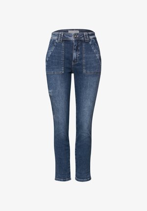 Jeans in denim blu scuro con vita alta, due ampie tasche anteriori e un design slim fit. Presentano cuciture a contrasto sulle tasche.