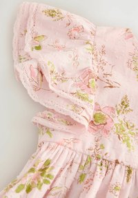 Light pink fabric with green and pink floral print, featuring ruffled sleeve edged with lace on a gathered dress.