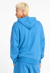 New Balance SPORT ESSENTIALS FRENCH TERRY - Hoodie - blue light blue