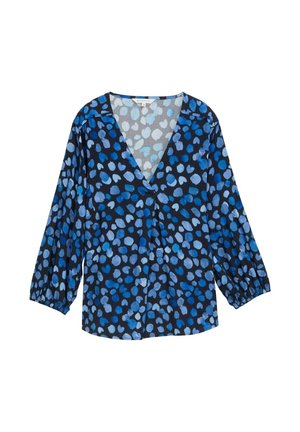 Blouse bleue et noire avec un décolleté en V, des manches longues ballons et un motif à pois dans différentes nuances de bleu. Tissu léger avec une texture douce.