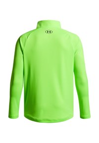 Chemise à manches longues et col montant de couleur vert néon vif. Fabriquée en tissu lisse et léger. Présente un petit logo au dos, au niveau du col.