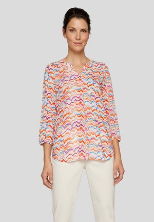 Bunte Bluse mit einem Wellenmuster in Rosa-, Orange- und Blautönen. Sie hat Dreiviertelärmel und ein V-Ausschnitt-Design.