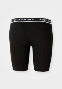 Schwarze Boxershorts aus weichem Material mit einem weißen Bund, auf dem "JACK & JONES" steht. Glatte Textur und taillierte Passform.