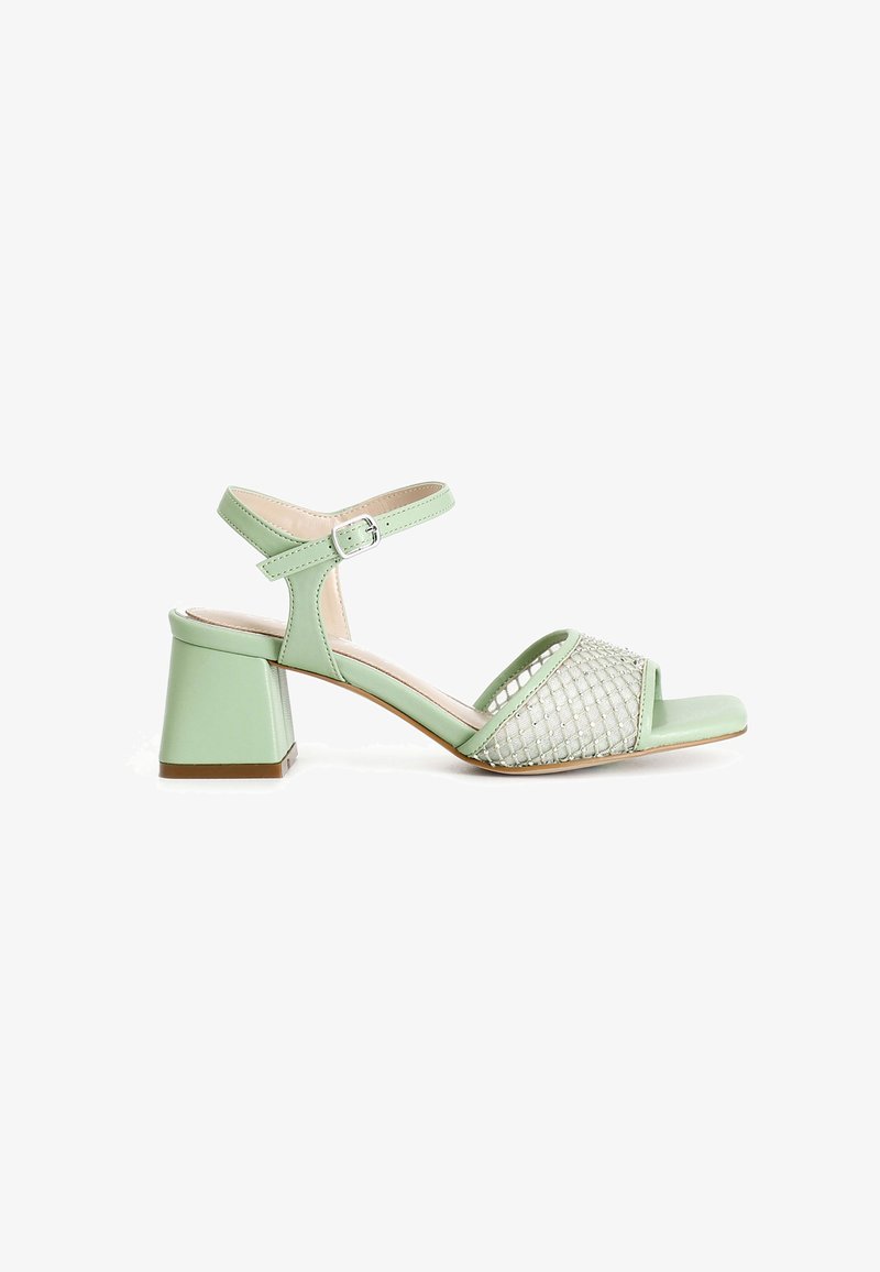 Green heeled sandals with an open toe, ankle strap, and a square block heel. Features a woven mesh design on the vamp.