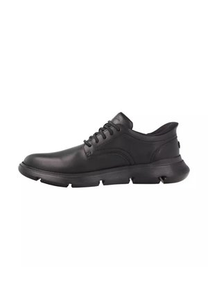 Scarpe in pelle nera con punta tonda, design con lacci e suola in gomma strutturata con scanalature verticali. Design minimalista con accenti laterali.