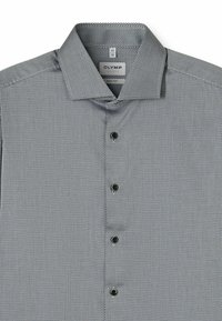 Black and white patterned dress shirt with a pointed collar, five button placket, and small black buttons. Body fit design, textured fabric.