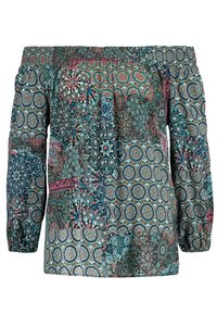 Olkapäiltä avonainen pusero, jossa on pitkät hihat ja monivärinen kuviokangas, jossa on teal-, vaaleanpunaisia ja valkoisia ympyröitä sekä kukkakuoseja.