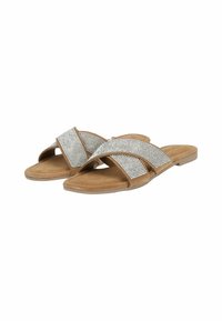 Brown flat sandals with two wide crossed straps featuring silver rhinestone detailing, on a textured sole for grip and comfort.