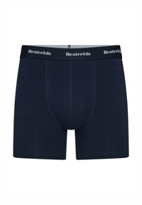 Dark navy cotton boxers featuring a fitted design, a smooth texture, and an elastic waistband with "Resteröds" printed in white.