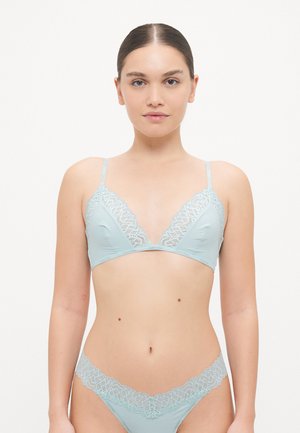 Light blue lace-trimmed bra and matching thong with a smooth, soft fabric and triangular design, featuring adjustable straps and logo detail.