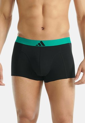 Boxer shorts noirs avec une ceinture élastique turquoise présentant un motif texturé et un accent logo noir. Tissu extensible confortable.