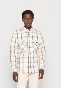 Karl Kani CHEST SIGNATURE CHECK LIGHT UNISEX - Casaco de verão - light sand