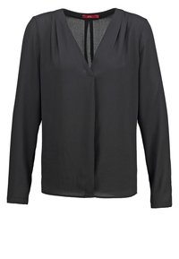 Blouse noire à manches longues avec col en V, plis près des épaules et coupe légèrement ample.
