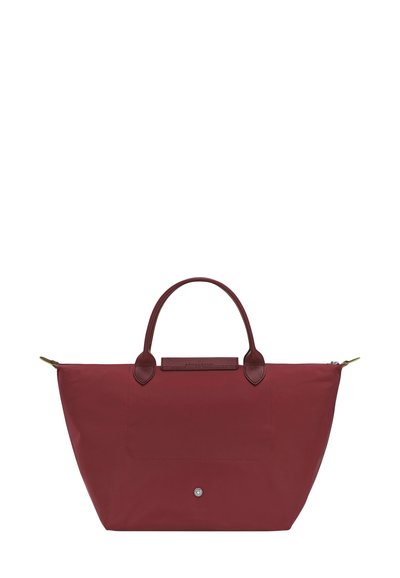Reddish-burgundy tote bag made of durable nylon, featuring two leather handles, a front pocket, and a metal snap closure.