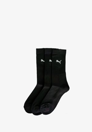 Schwarze Baumwoll-Socken, Crew-Style, mit Rippstruktur, drei Paare, mit kleinen weißen Puma-Logos an den Seiten. Klassisches Design für den täglichen Gebrauch.