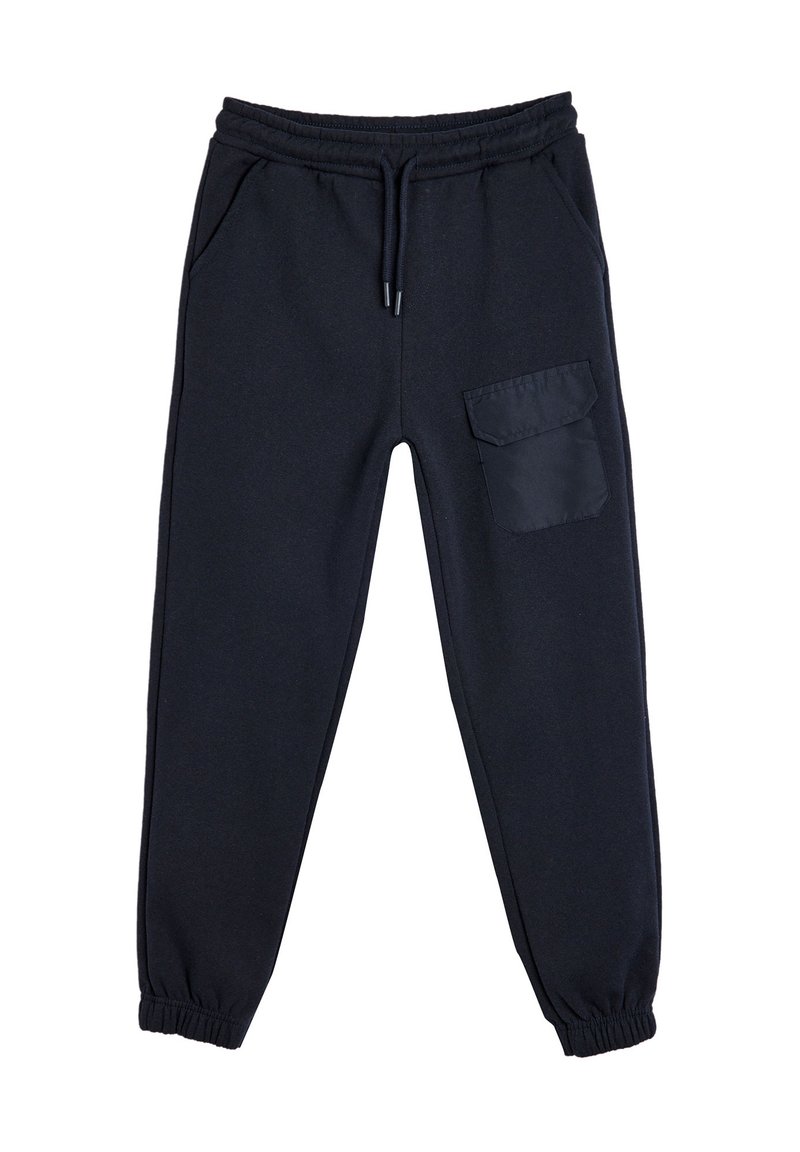 Schwarze Jogginghosen aus weichem Stoff, mit elastischem Bund, Seitentaschen und einer großen aufgesetzten Tasche am rechten Bein.