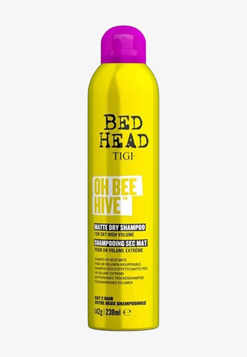 Heller gelber Aerosoldose mit lila Kappe, beschriftet mit "Bed Head TIGI Oh Bee Hive Matte Dry Shampoo" für voluminöses Haar.