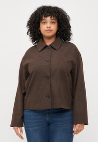 Brown, textured, button-up jacket with a collar and long sleeves, featuring a relaxed fit and five buttons down the front.