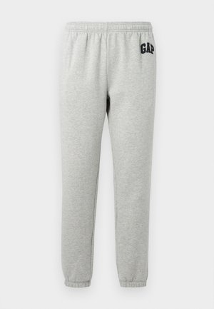 Graue Jogginghose mit elastischem Bund, abgeklebten Knöcheln und einem dunkelblauen "GAP"-Logo auf dem linken Oberschenkel. Weicher Baumwollmischstoff.