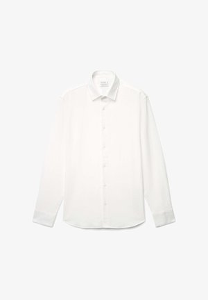 White long-sleeve button-up shirt made of smooth fabric, featuring a classic collar and a rounded hem, with five front buttons.