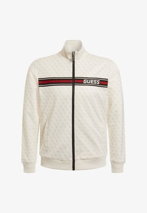 Giacca bianca con zip e colletto alto, motivo sottile, banda a strisce rossa e nera con il logo "GUESS" sul petto. Polsini e orlo a coste.