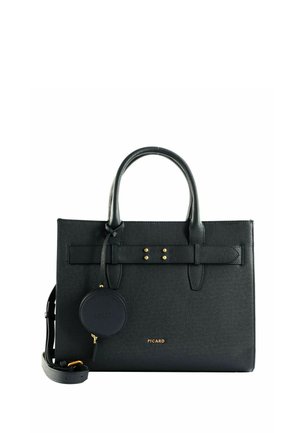 Sac à main structuré en cuir noir avec double poignées, bandoulière amovible, petite pochette ronde et accents de quincaillerie dorée.