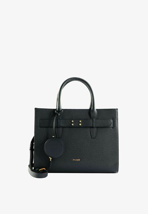 Sac à main structuré en cuir noir avec double poignées, bandoulière amovible, petite pochette ronde et accents de quincaillerie dorée.