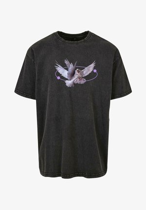 Črna oversized bombažna majica z grafiko ptice z razprtimi krili, okroglimi vijoličastimi poudarki in teksturirano površino.