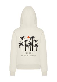 Beige Kapuzenpullover mit einem großen schwarzen Palmenmotiv, einer orangefarbenen Sonne und dem Text "ESCAP3 AND DISCOVER THE WORLD" unter dem Design.
