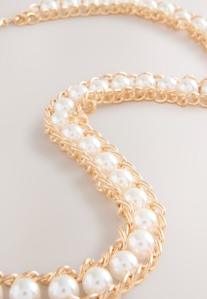 Next Diržas - gold tone pearl bead