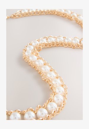 Next Vöö - gold tone pearl bead