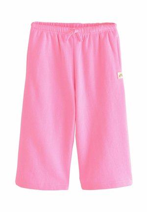 Roze katoenen shorts met een elastische tailleband en een trekkoord. Bevat een klein label met een regenboogontwerp aan de zijkant.