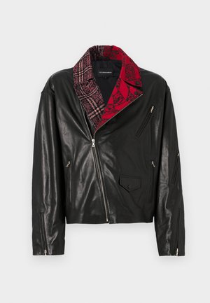 Black leather jacket with a red and gray patterned collar, multiple zip pockets, and angled zip closures on the sleeves.