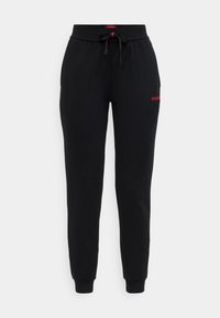 Black jogger pants made of soft fabric, featuring an elastic waistband, adjustable drawstring, and subtle red logo on the left thigh.