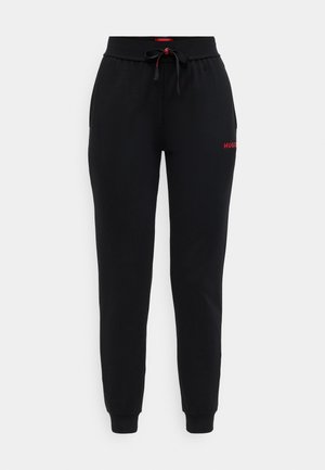 Black jogger pants made of soft fabric, featuring an elastic waistband, adjustable drawstring, and subtle red logo on the left thigh.