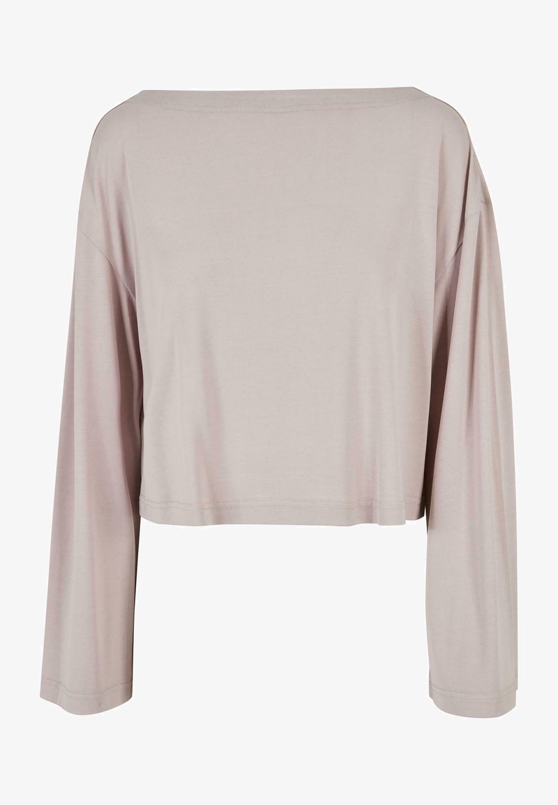 Lys grå cropped langærmet top lavet af blødt materiale med en løs pasform, rund halsudskæring og minimale syninger.