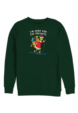 Zielona bluza z nadrukiem Grincha w stroju Mikołaja, jeżdżącego na nartach z workiem prezentów, z napisem "JESTEM TU DLA PREZENTÓW."